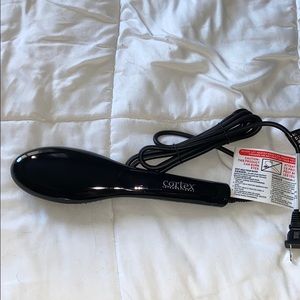 Heated hair straightening brush